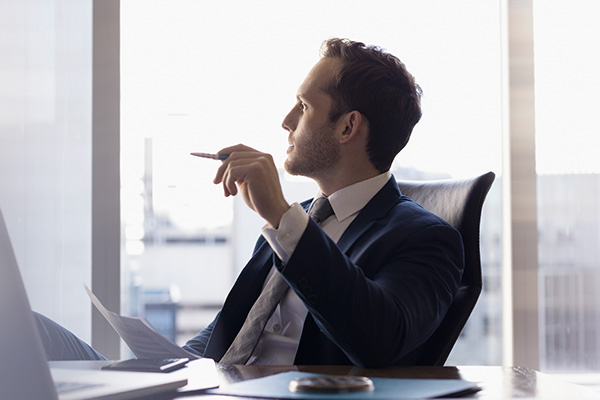 Business men think full looking outside the window
